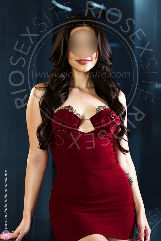 Elegant model in Rio wearing tight red dress with cleavage
